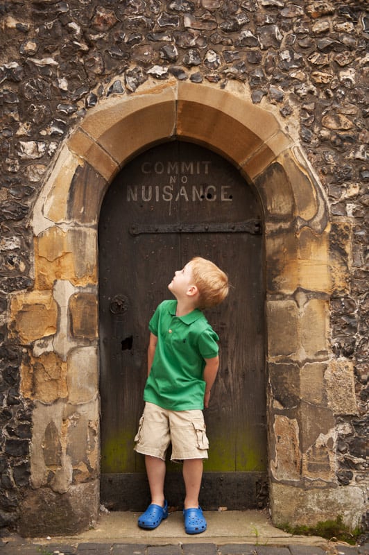 Family photographer St Albans boy with sign Commit No Nuisance